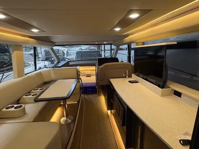 Slide: The Image of Luxurious interior of 2018 Regal 42 Grande Coupe yacht with modern seating and entertainment area. - 6