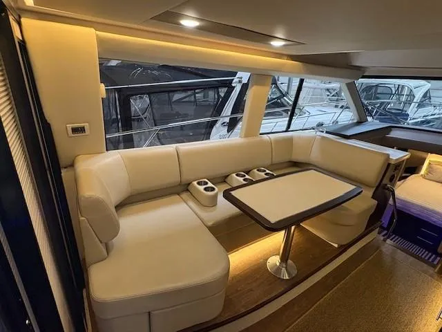 Slide: The Image of Luxurious interior of 2018 Regal 42 Grande Coupe yacht with elegant seating and table. - 7