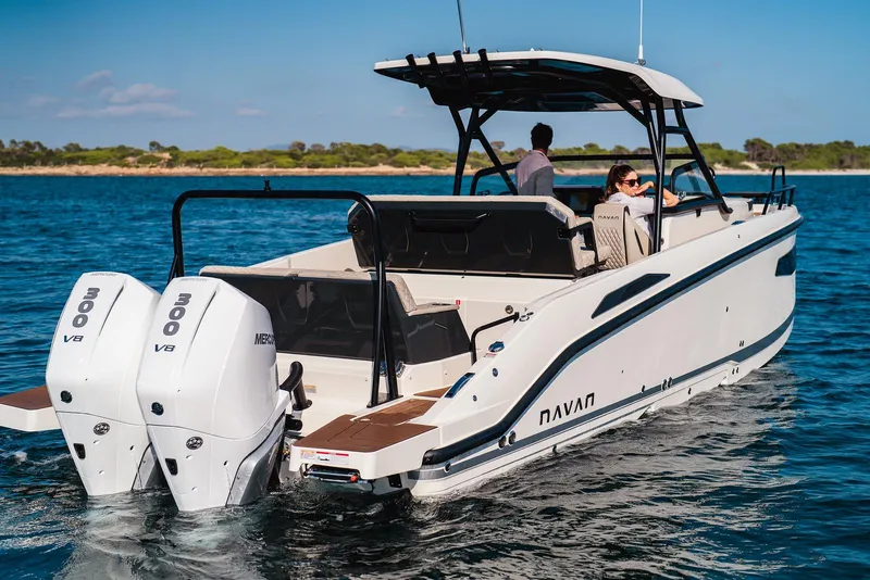 The Image of 2025 Navan S30 boat cruising on water with dual V8 engines. - 0