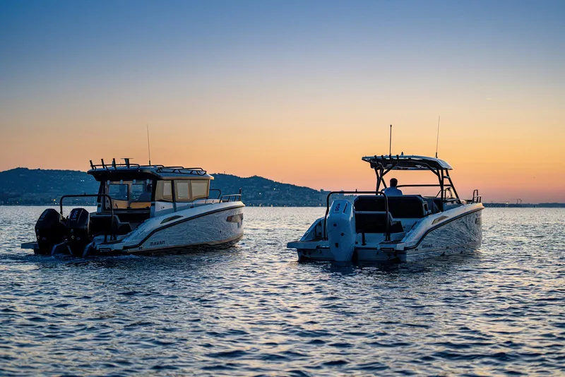 Slide: The Image of Two Navan S30 boats on water at sunset, 2025 model. - 15