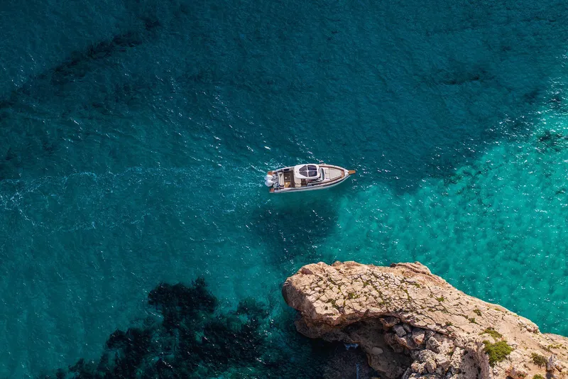 Slide: The Image of Aerial view of Navan S30 yacht cruising in clear blue waters, 2025 model. - 19