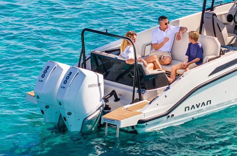 Slide: The Image of 2025 Navan S30 boat with family enjoying a sunny day on clear blue water. - 21