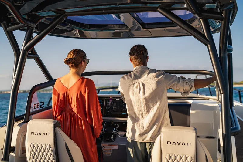 Slide: The Image of Two people on a 2025 Navan S30 boat, enjoying a sunny day at sea. - 23