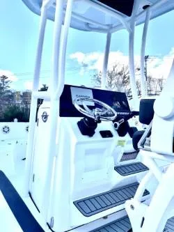 Slide: The Image of 2025 Tidewater 198 CC Adventure boat interior with steering console and seating. - 4