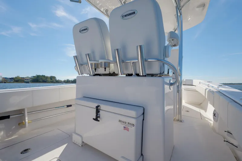 Slide: The Image of Contender 25 boat interior, 2022 model, featuring dual seats and storage compartment. - 10