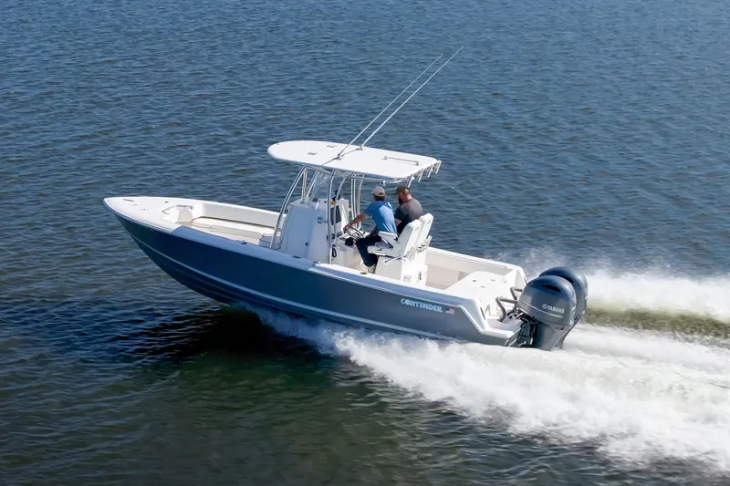 Slide: The Image of 2022 Contender 25 boat cruising on open water, showcasing speed and performance. - 14
