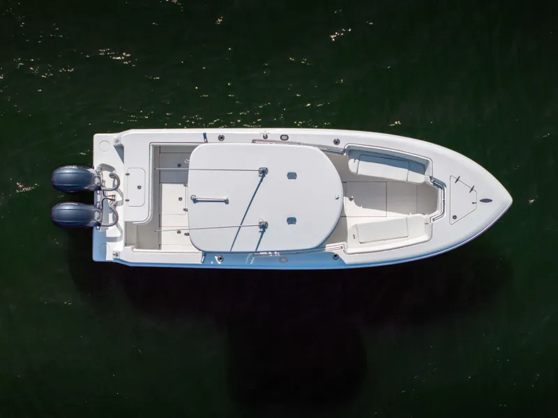 Slide: The Image of Aerial view of 2022 Contender 25 boat on water. - 19