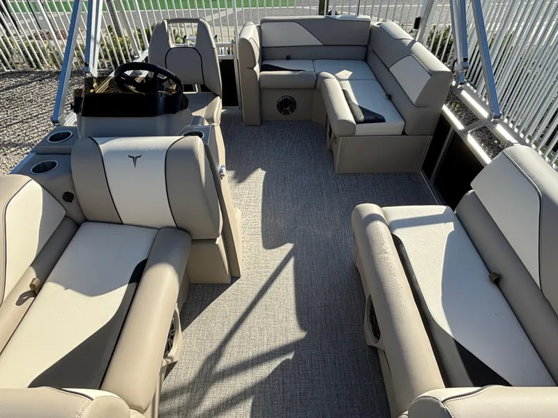 Slide: The Image of 2025 Tahoe Pontoon 15 Sport interior with gray and blue seating, spacious layout. - 3