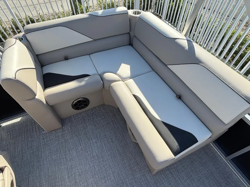 Slide: The Image of 2025 Tahoe Pontoon 15 Sport interior with gray seating and modern console design. - 6