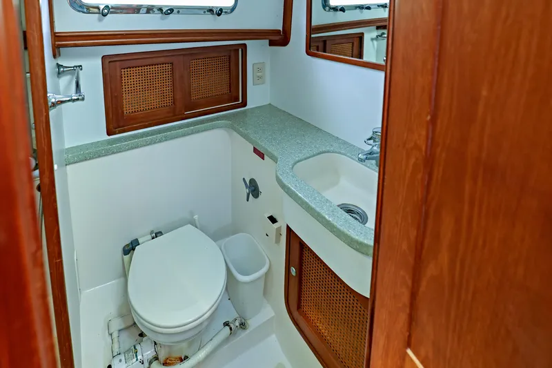 Slide: The Image of Bathroom interior of 2000 Legacy Flybridge Downeast yacht with toilet and sink. - 47