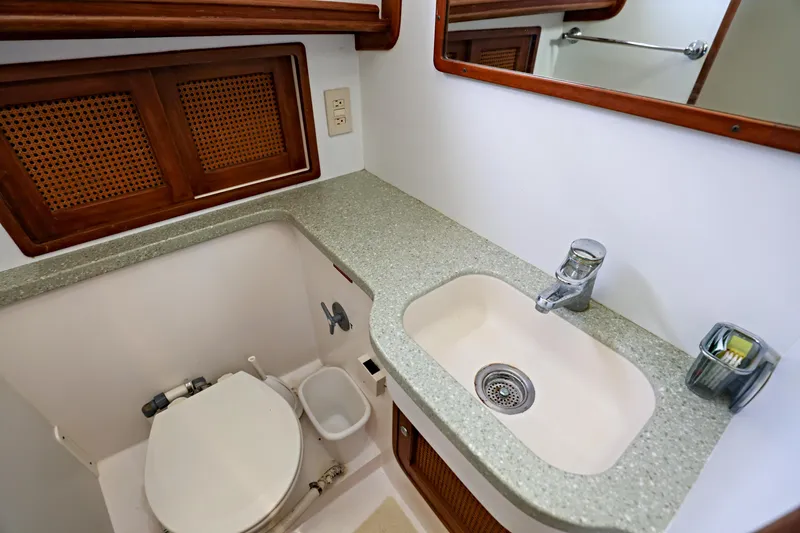 Slide: The Image of Bathroom interior of 2000 Legacy Flybridge Downeast boat with sink and toilet. - 48