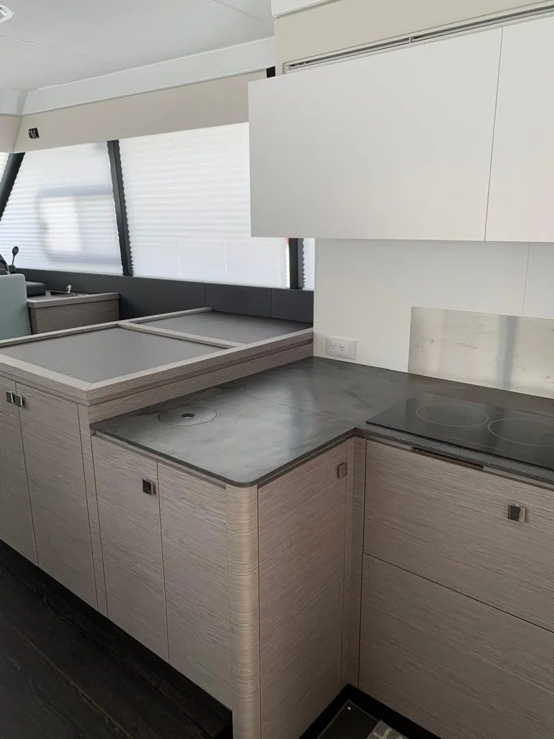 Slide: The Image of Modern kitchen interior of 2024 Fountaine Pajot MY5 yacht with sleek countertops. - 5