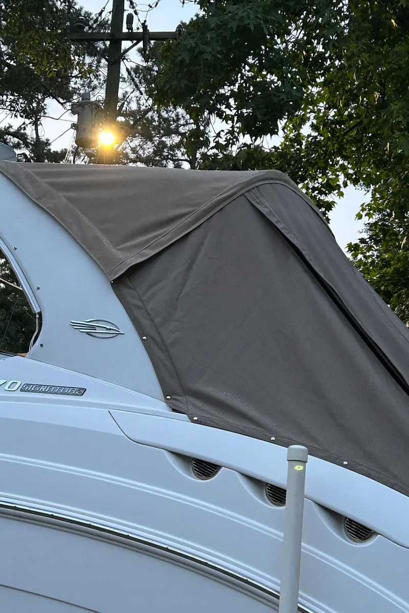 Slide: The Image of 2011 Chaparral 270 Signature boat with cover outdoors. - 21