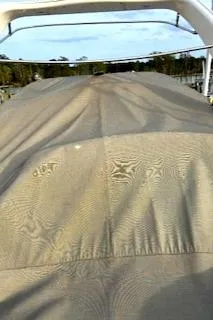 Slide: The Image of Covered Chaparral 270 Signature boat, 2011 model, parked outdoors. - 24