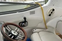 Slide: The Image of Interior of a 2011 Chaparral 270 Signature boat with steering wheel. - 26