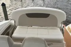 Slide: The Image of Rear view of a 2011 Chaparral 270 Signature boat by the water. - 29