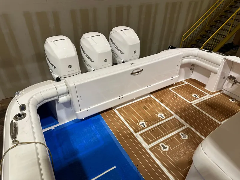 Slide: The Image of 2017 Intrepid 430 Sport Yacht with triple Mercury engines and teak deck. - 22