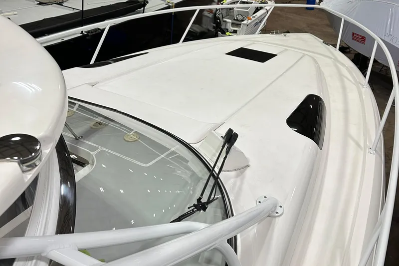 Slide: The Image of 2017 Intrepid 430 Sport Yacht, sleek white deck, modern design, docked in marina. - 24