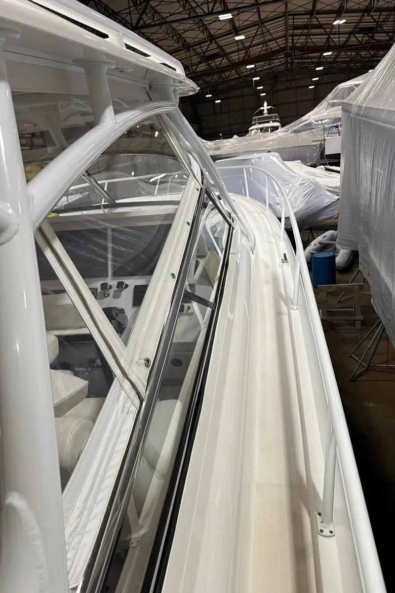 Slide: The Image of 2017 Intrepid 430 Sport Yacht in storage, showcasing sleek design and spacious deck. - 27