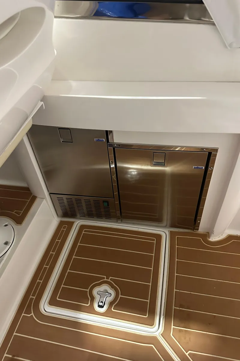Slide: The Image of 2017 Intrepid 430 Sport Yacht interior with sleek cabinetry and stylish flooring. - 34