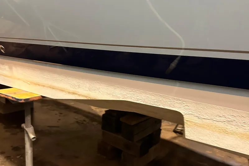 Slide: The Image of 2017 Intrepid 430 Sport Yacht hull on blocks in a workshop. - 4