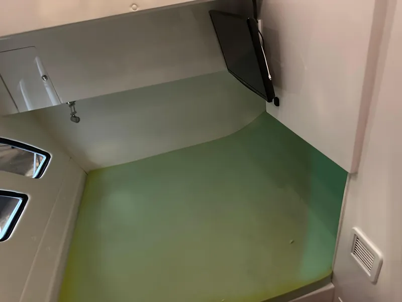 Slide: The Image of Interior cabin of 2017 Intrepid 430 Sport Yacht with TV and windows. - 42