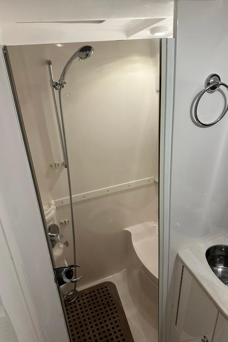 Slide: The Image of Shower area in 2017 Intrepid 430 Sport Yacht, featuring modern fixtures and compact design. - 43