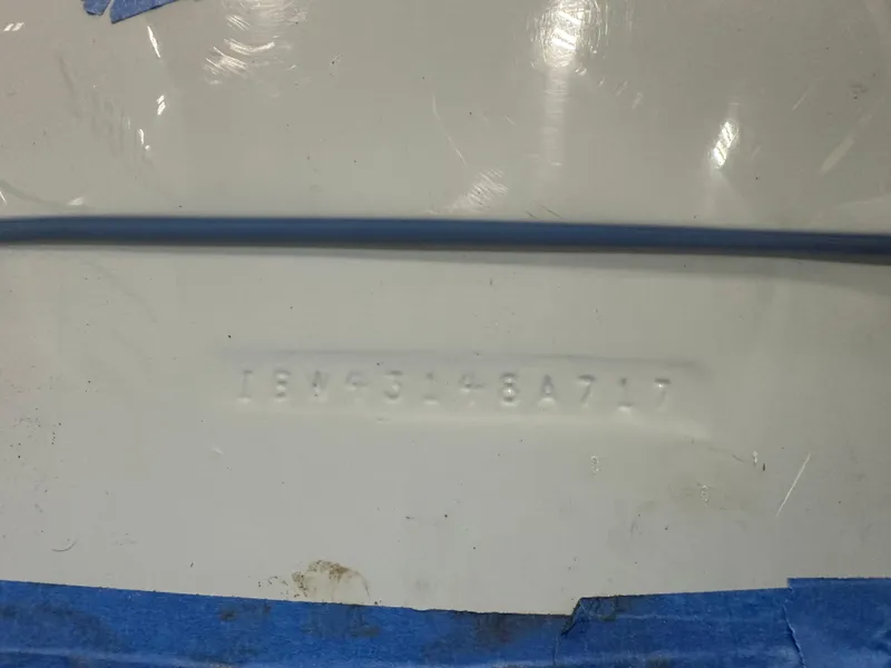 Slide: The Image of Hull identification number on 2017 Intrepid 430 Sport Yacht, partially obscured by blue tape. - 45
