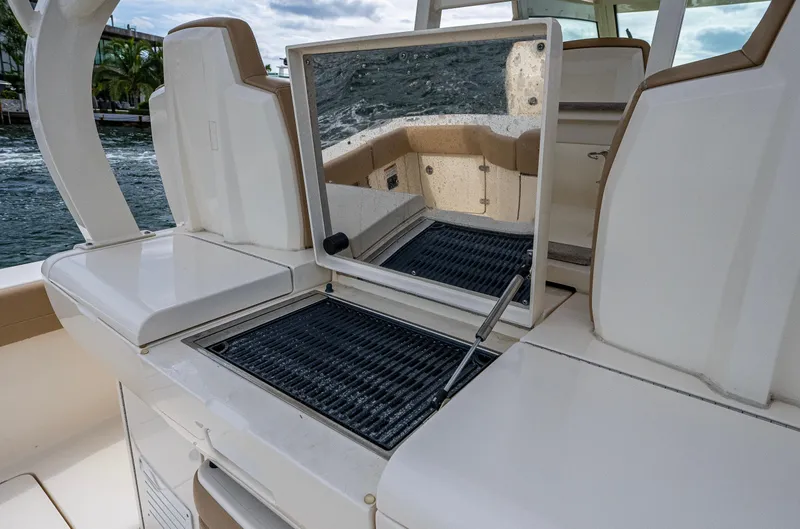 Slide: The Image of 2019 Scout 420 LXF boat interior with seating and storage compartments. - 10