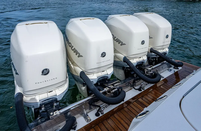 Slide: The Image of Four Mercury outboard engines on a 2019 Scout 420 LXF boat. - 14