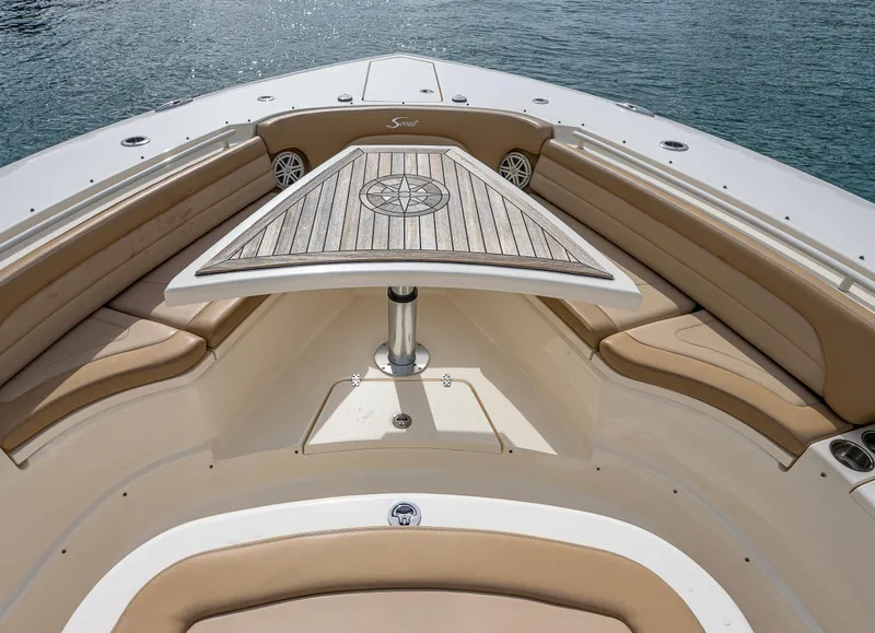 Slide: The Image of 2019 Scout 420 LXF boat interior with elegant seating and table. - 6