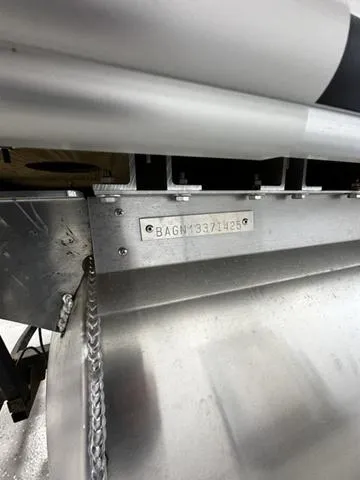 Slide: The Image of 2025 Bentley Pontoons 200 Navigator, close-up of metal structure with serial number. - 11