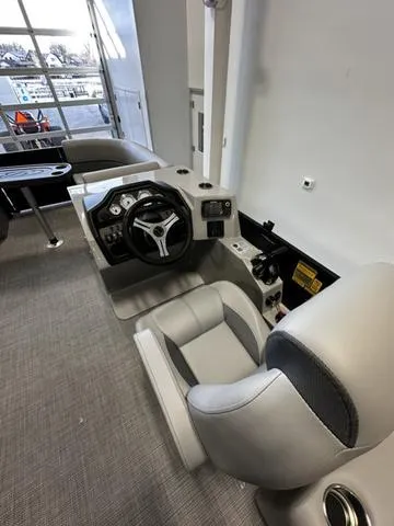 Slide: The Image of 2025 Bentley Pontoons 200 Navigator interior with modern steering and seating. - 6