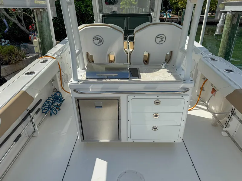 Slide: The Image of 2019 Edgewater 320CC boat interior with seating and storage compartments. - 39