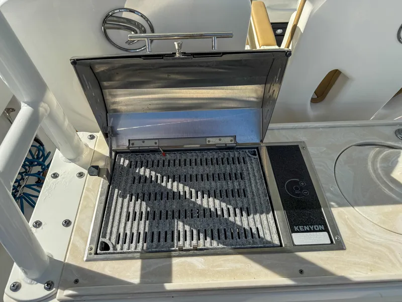 Slide: The Image of 2019 Edgewater 320CC boat grill with Kenyon cooking surface. - 52