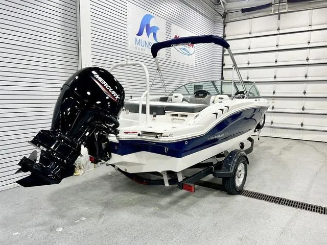 Slide: The Image of 2024 Chaparral 19 SSi OB boat with Mercury outboard in showroom. - 4