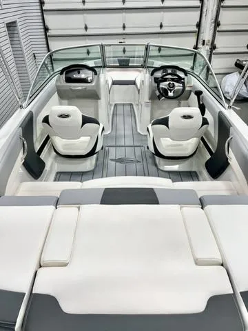 Slide: The Image of 2024 Chaparral 19 SSi OB boat interior with modern seating and sleek design. - 5