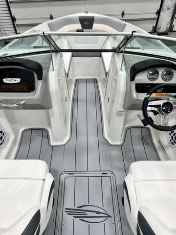 Slide: The Image of 2024 Chaparral 19 SSi OB boat interior with sleek dashboard and modern design. - 6