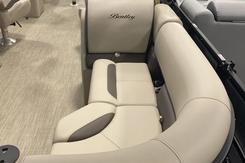 Slide: The Image of 2025 Bentley Pontoons 223 NAVIGATOR interior with beige and gray seating. - 13