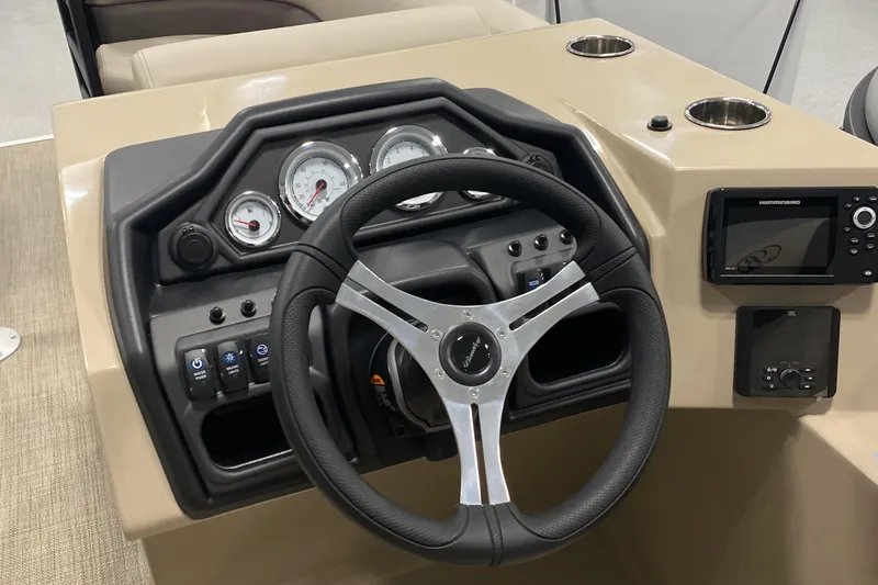 Slide: The Image of 2025 Bentley Pontoons 223 NAVIGATOR dashboard with steering wheel and navigation system. - 8