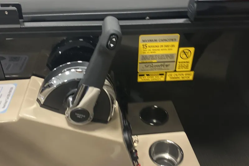 Slide: The Image of Throttle control and cup holders on 2025 Bentley Pontoons 223 NAVIGATOR. - 9