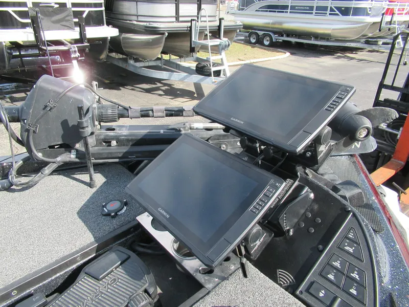 Slide: The Image of 2024 Caymas CX 20 boat dashboard with dual electronic displays and control panel. - 4