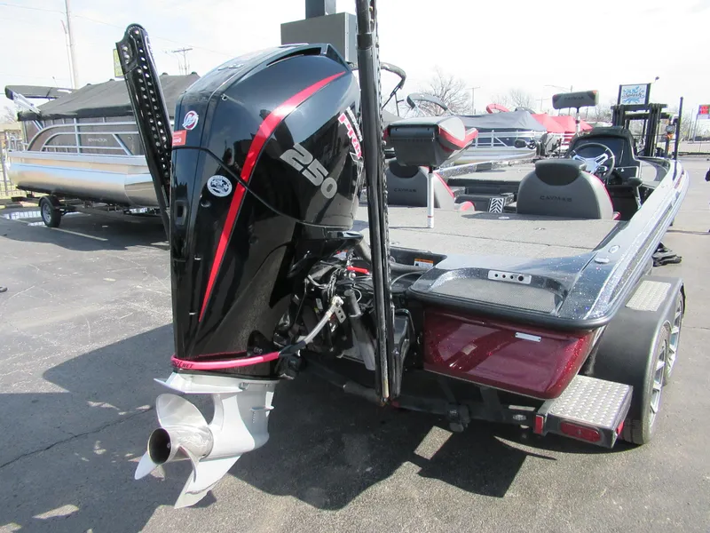 Slide: The Image of 2024 Caymas CX 20 boat with powerful 250 HP engine, displayed outdoors. - 6