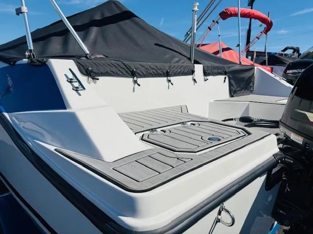 Slide: The Image of 2024 Starcraft SVX 171 boat with sleek deck design and modern features. - 6