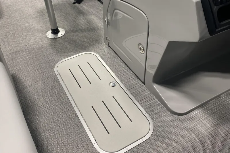 Slide: The Image of 2025 Bentley Pontoons 223 Swingback interior with sleek flooring and storage compartment. - 10