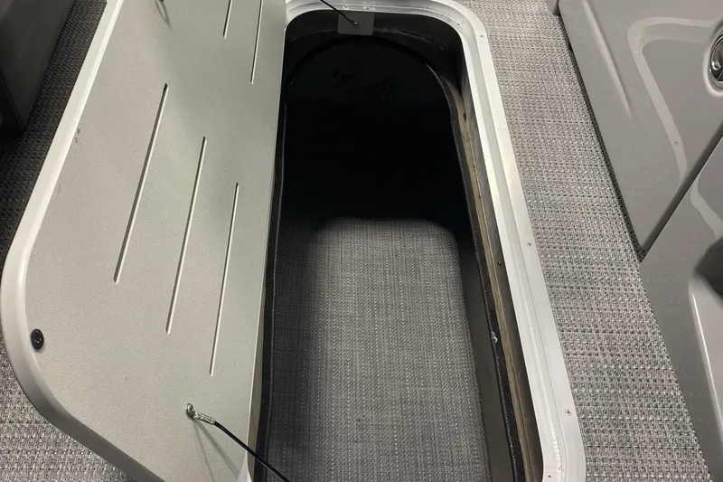 Slide: The Image of Open storage compartment in 2025 Bentley Pontoons 223 Swingback boat. - 11