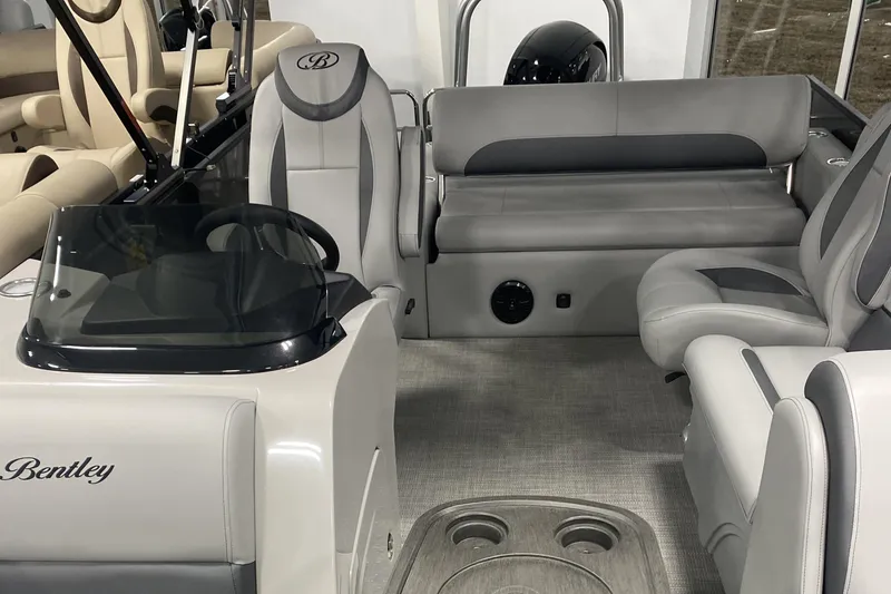 Slide: The Image of 2025 Bentley Pontoons 223 Swingback interior with gray seating and modern design. - 6