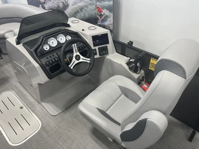 Slide: The Image of 2025 Bentley Pontoons 223 Swingback helm with modern controls and comfortable seating. - 8