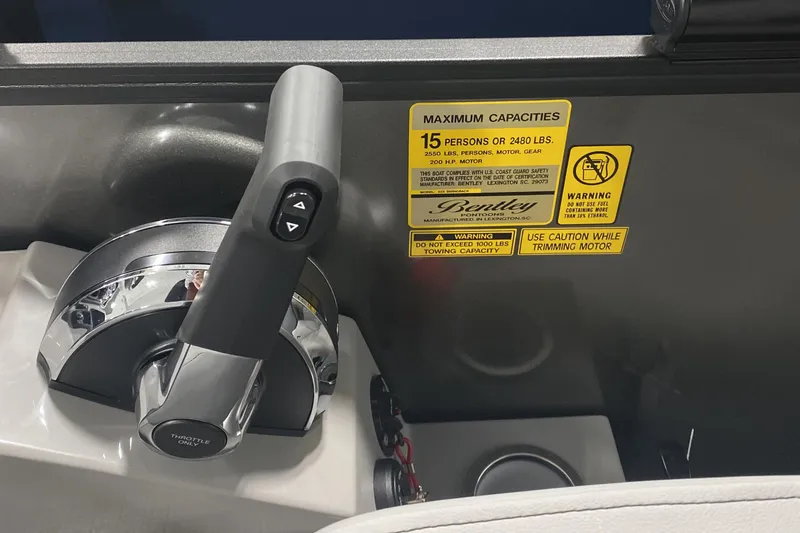 Slide: The Image of Throttle control and capacity label on 2025 Bentley Pontoons 223 Swingback boat. - 9