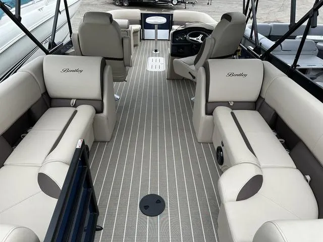Slide: The Image of 2024 Bentley Pontoons Legacy 243 Navigator interior with luxurious seating and modern design. - 3
